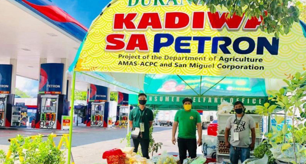 Kadiwa sa Petron tent displaying various goods such as vegetables, fruits and rice