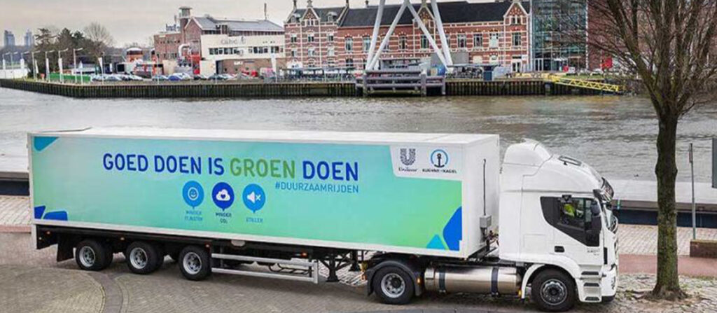 A truck with the sea port in the background