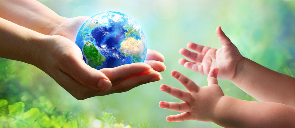 Artwork of a woman's hand holding the earth and handing it over to a tiny set of hands